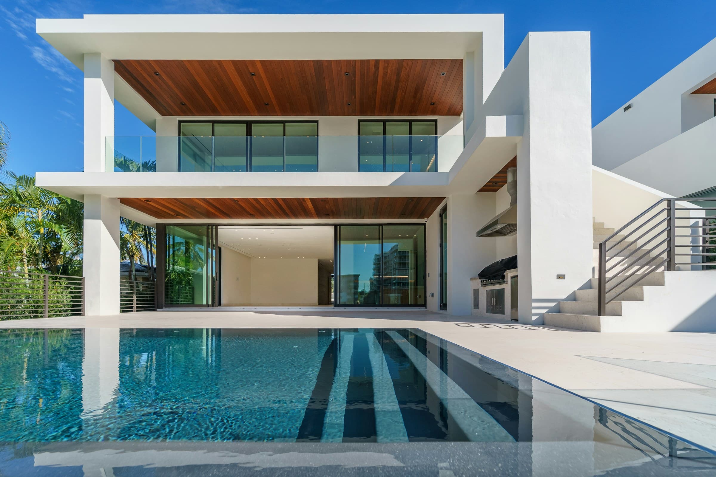 Finished modern custom home exterior in daylight