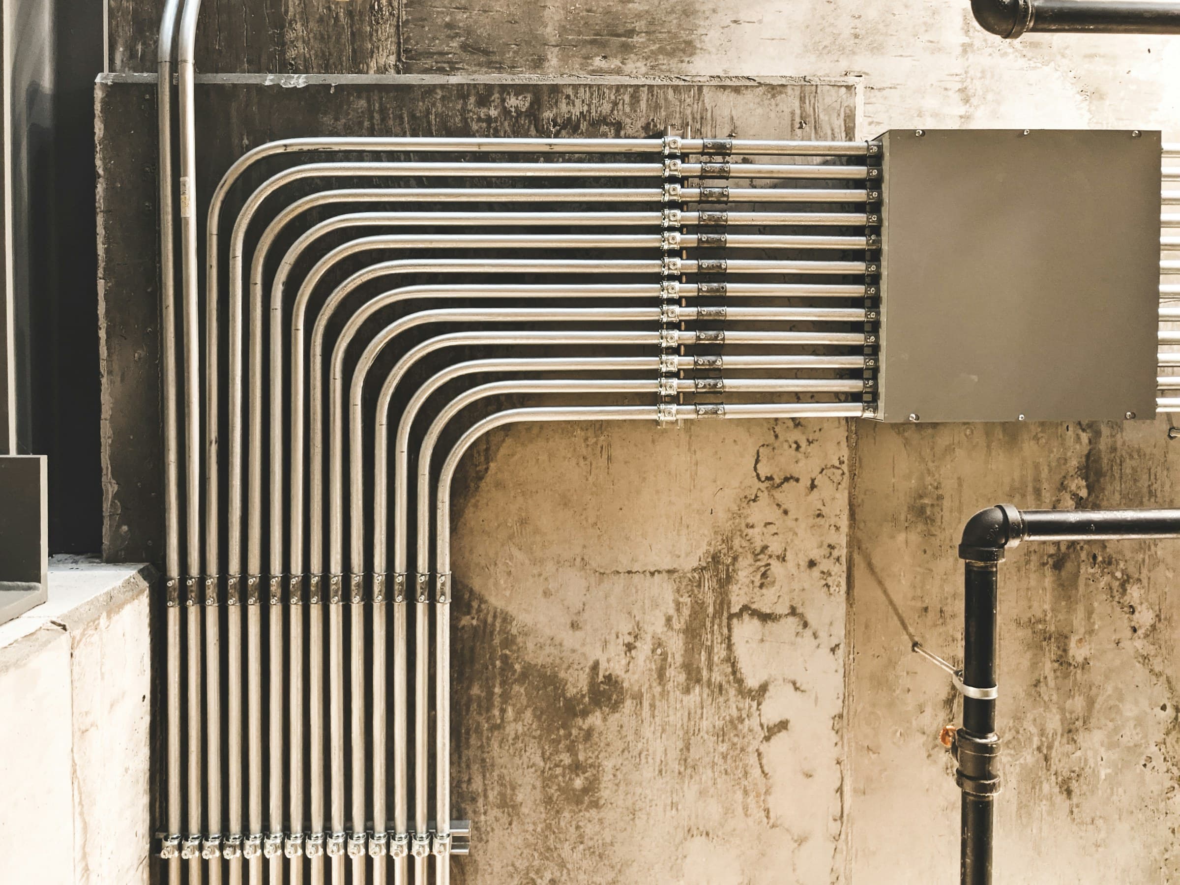 Electrician running conduit in a commercial building